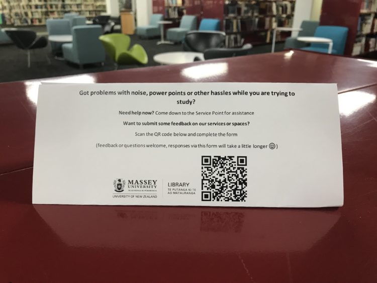 Photo shows a table talker prototype giving information about how to give feedback to the Library.